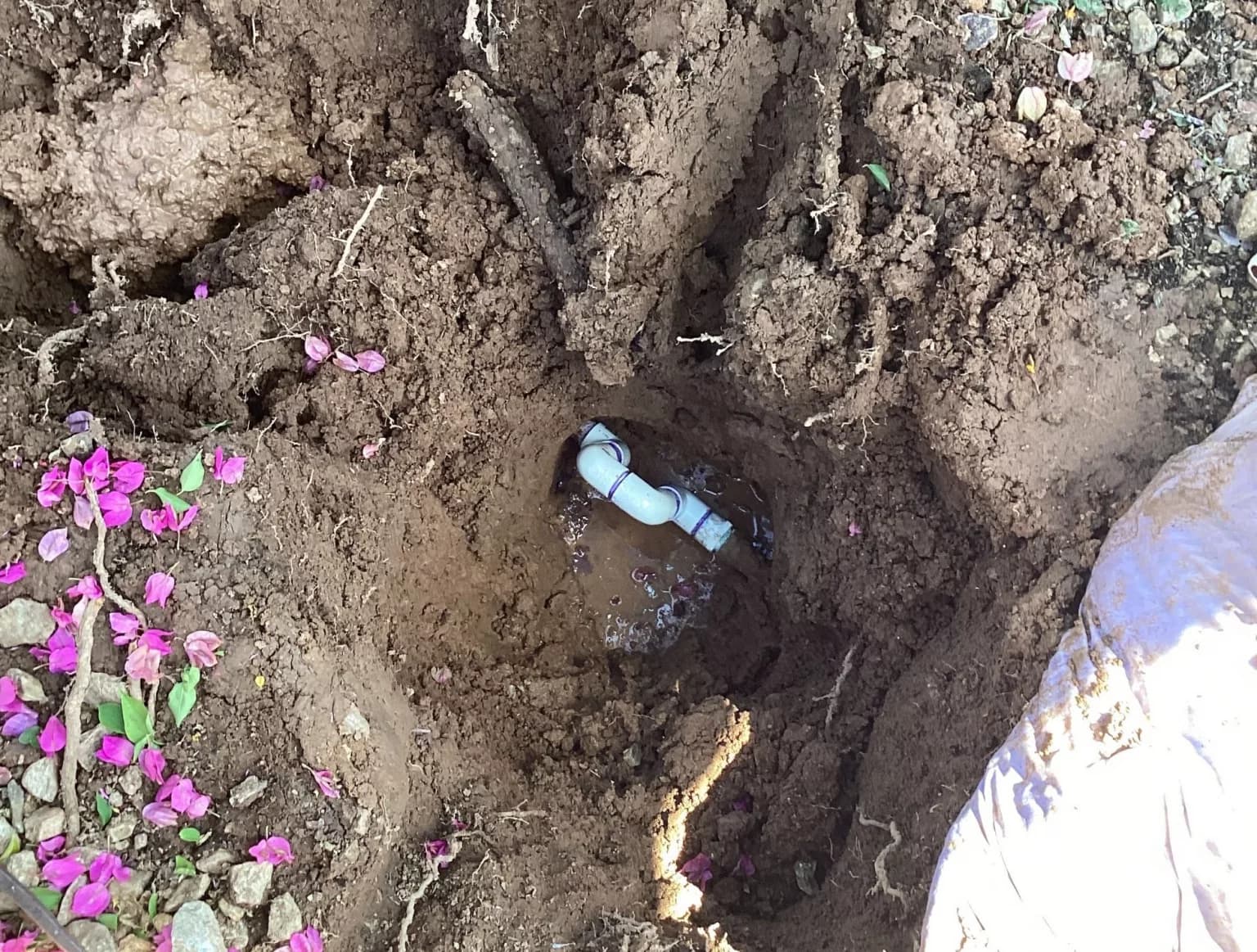 Underground pipe leak being repaired
