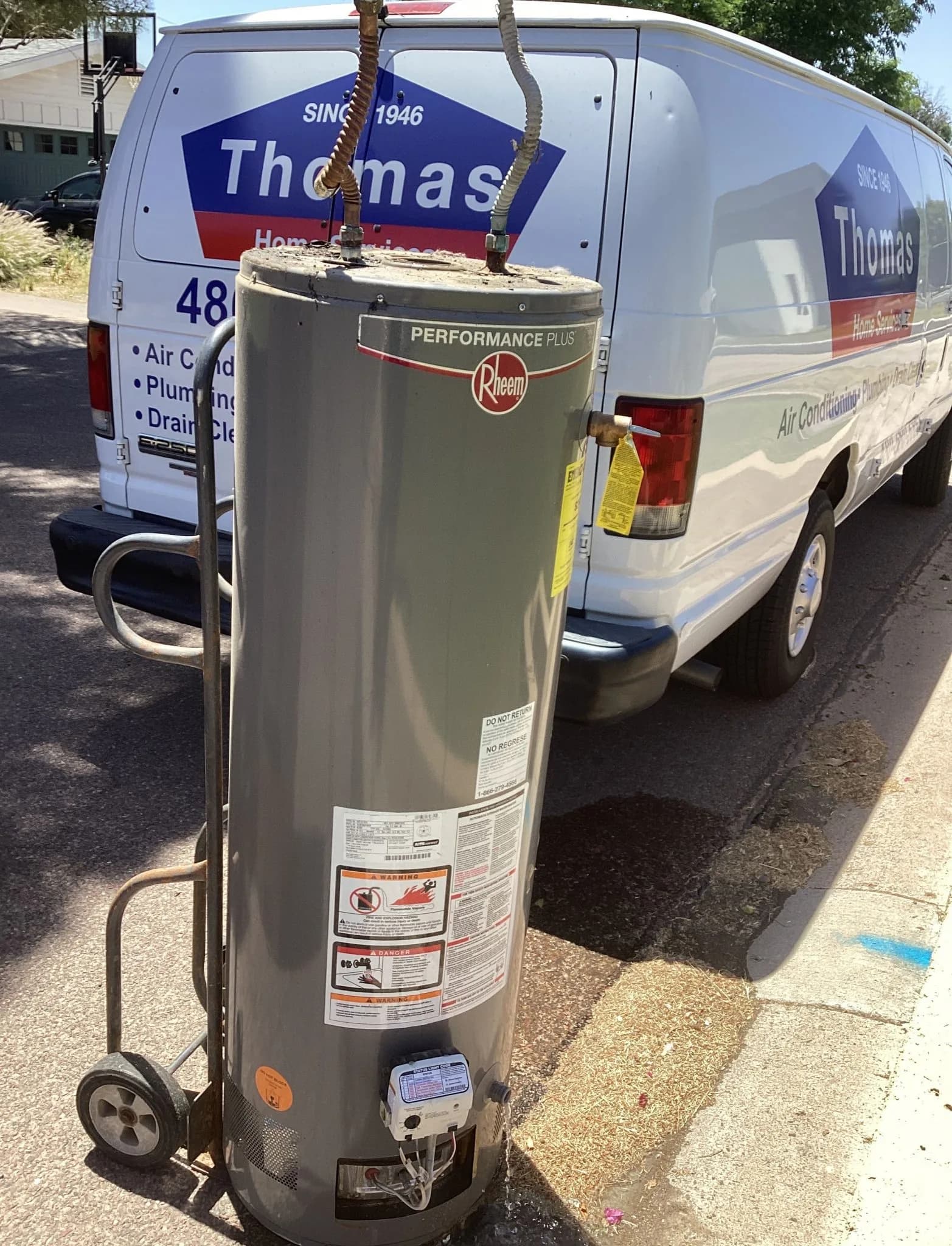 Thomas plumber repairing a water heater